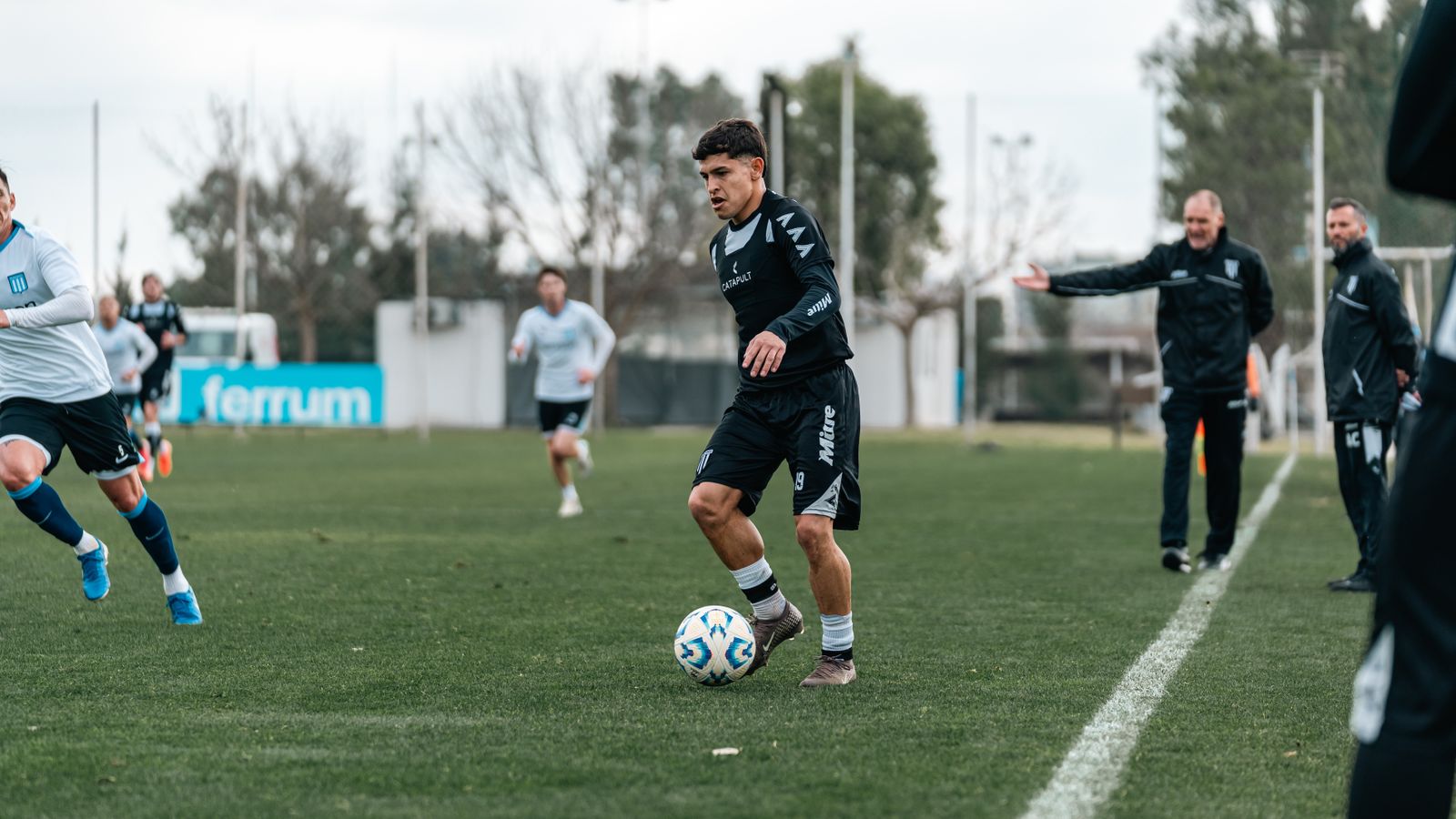 Soccer players training on an outdoor field