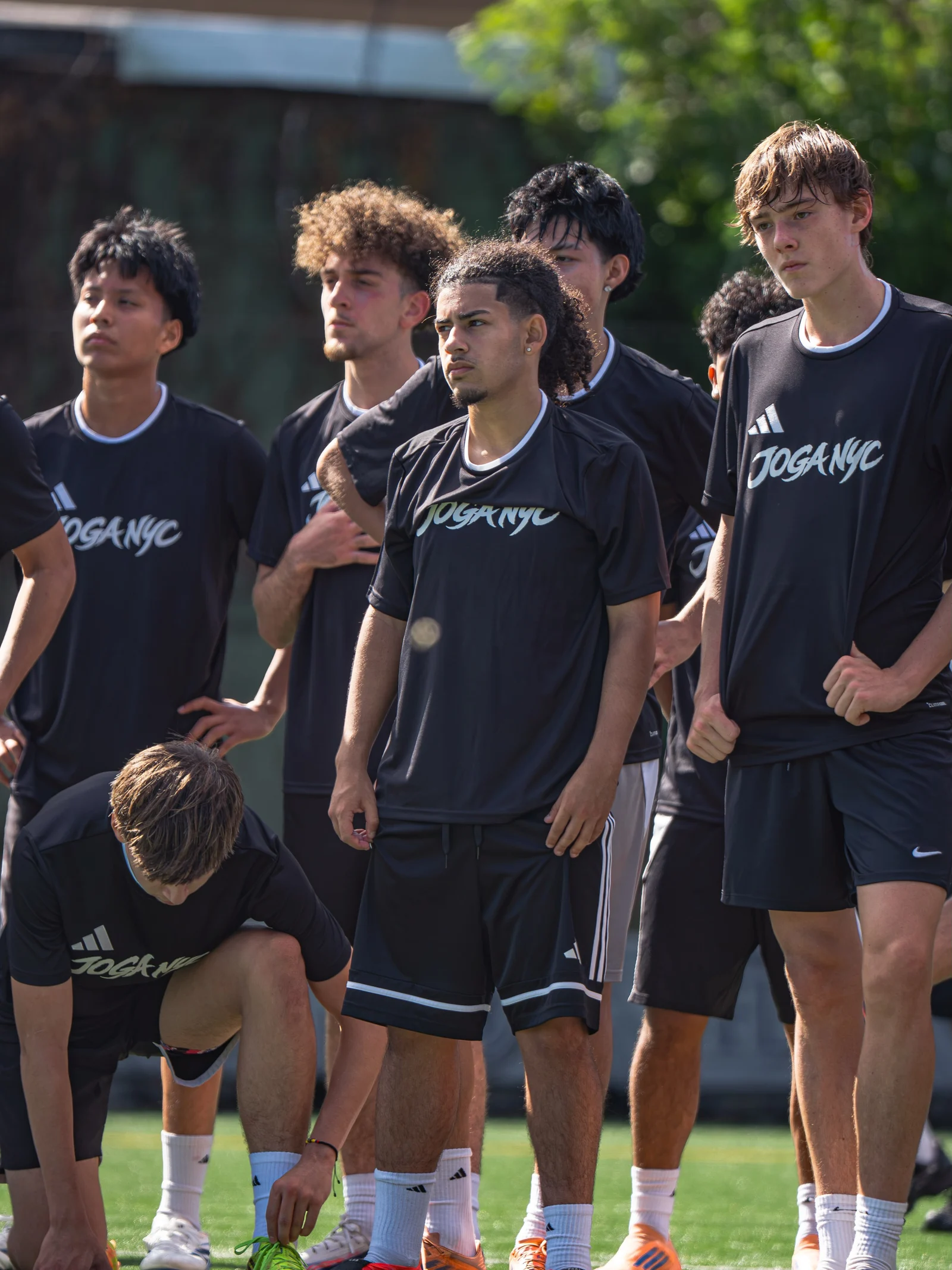 Players together in black JOGA NYC shirts at the October 12 Showcase
